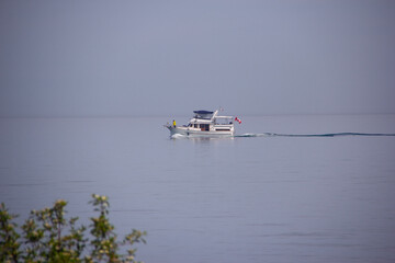 Motorized boat on a quiet Lake Ontario