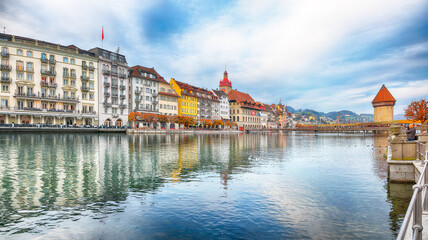 Breathtaking historic city center of Lucerne with famous buildings and old wooden Chapel Bridge...
