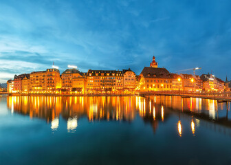 Beautiful historic city center of Lucerne with famous buildings during night..