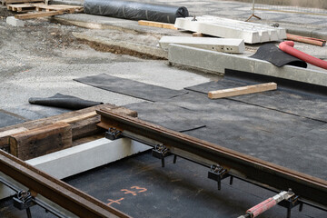 pneumatic pad at a construction site of tram tracks in a European city street. Made from recycled rubber of old tires.