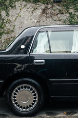 Luxurious black car with white curtains looks like an official automobile