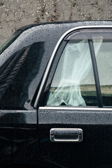 Luxurious black car with white curtains looks like an official automobile