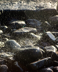 water splashing on rocks