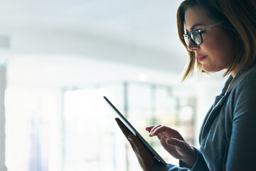 Tablet, planning and business woman in office for reading email, thinking and working with tech....