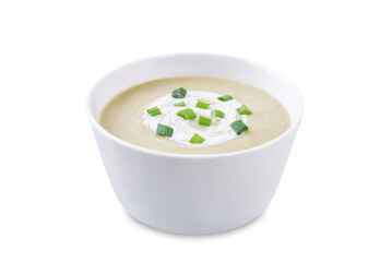 Celery greens soup with cream and scallions in a bowl on a white isolated background