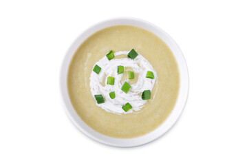 Celery greens soup with cream and scallions in a bowl on a white isolated background