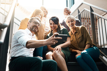 Group, people and stairs with smile or phone, diversity and lens flare in office. Crowd, international and happiness with mobile technology for company profile picture, team building for employees