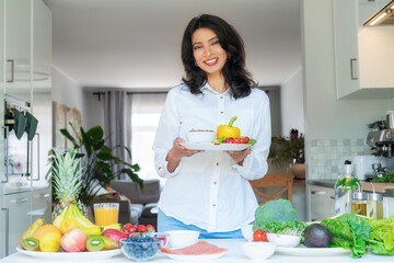 Indian Nutritionist makes healthy balanced diet plate according to proportions of nutrients. Expert...