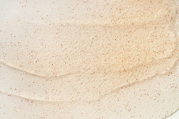 Beauty gel texture with particles. Beige background with brush strokes and particles
