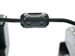 Close-up of a ferrite bead inductor on isolated white background     