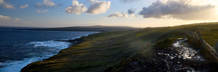 Muddy trail (Burren Way) looking back at Doolin in the morning