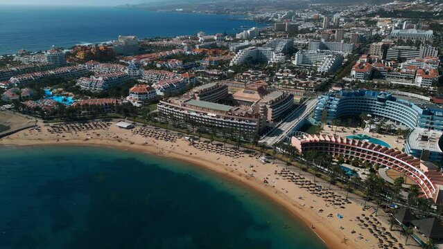 ocean shore with hotels and beach, Los Cristianos, Tenerife, Canary, aerial shot