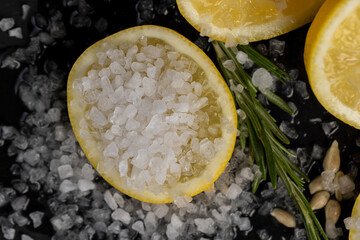 slices of sour lemon on a black board