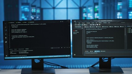 Computers in empty data center facility managing rackmounts energy consumption. Close up of script...