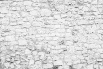 Stone wall for background design. A backing with natural stones for publication, poster, calendar, post, screensaver, wallpaper, postcard, banner, cover. Toned high quality photo
