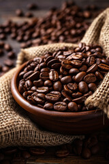 Fototapeta premium Wooden bowl filled with dark roasted coffee beans, on a burlap bag, with scattered beans in the background.