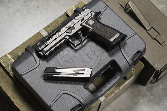 Baltic States July 6, 2024. A modern new pistol for sporting and tactical shooting, sig sauer 9mm, made in the USA.