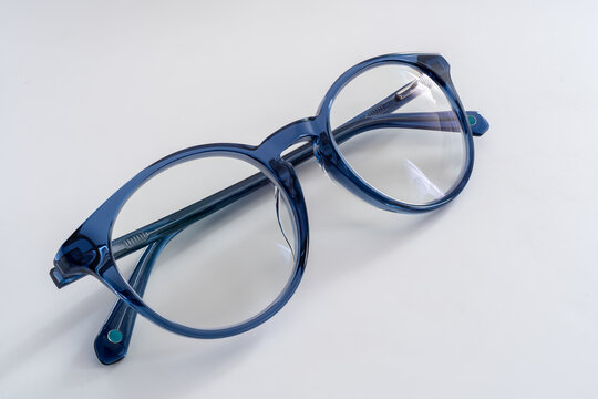 Pair of blue prescription eyeglasses isolated on a white background