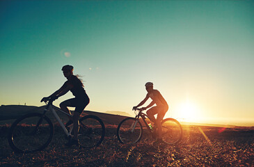 Sunset, silhouette and people on bicycle with fitness, race and exercise in nature together....