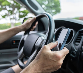 Naklejka premium Man texting while driving square shot