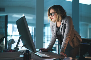 Woman, employee and reading on computer in office on browsing internet, online and research for...