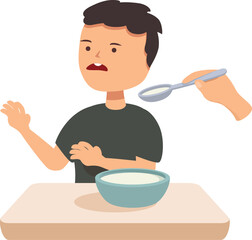 Young boy is refusing to eat his soup, pushing the spoon away with a scared expression on his face