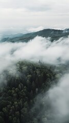 Obraz premium Aerial View of Fog Enveloping a Majestic Black Mountain