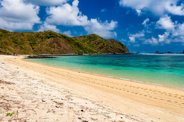 Plastic bags and bottles washed up on a tropical beach in Tampah,Lombok