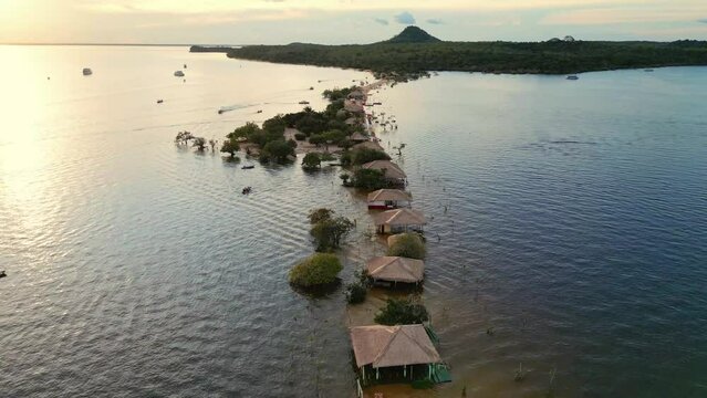 Aerial drone footage of "Alter do Chao" beach with most of its sandy shore submerged by the waters of the Tapajos river during the flood season