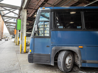 Selective blur on a Long Distance Bus ina American Bus Station portraying the coach system and the...