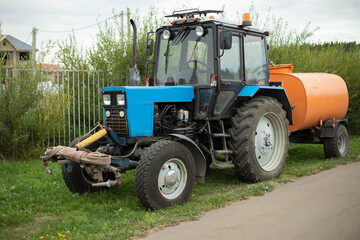 Tractor with water. Tractor equipped with system water irrigation. Agricultural machinery.