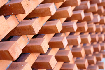 Background and Texture of Brick blocks or Red terracotta bricks. Beautifully arranged together with sunlight hitting them, creating dimension for the exterior building is modern architecture.