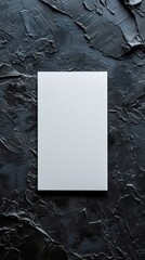 Blank white paper on textured black surface, abstract contrast concept