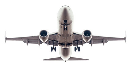 A large white airplane is flying through the sky