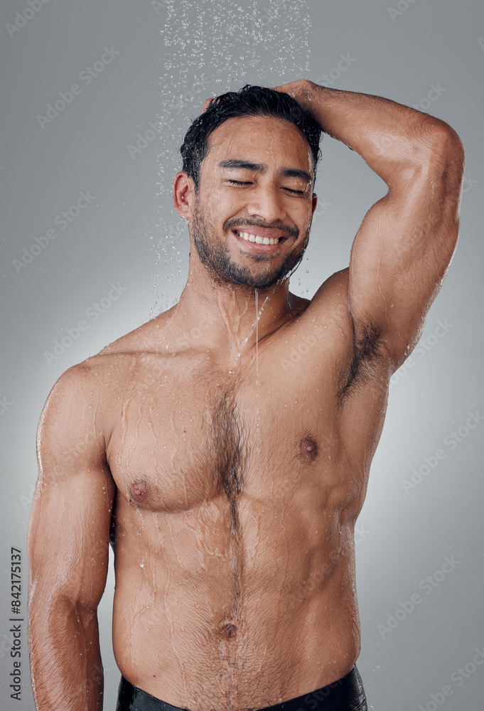 Poster Man, shower and cleaning in studio for haircare, water and confident for grooming on gray background. Male person, cosmetics and liquid for treatment in morning routine, health and hygiene or beauty