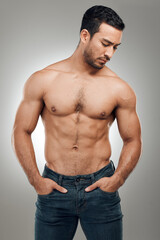 Man, body and thinking in studio with muscles or abs, shirtless and grey background with model or bodybuilder. Jeans, strong chest and Asian male person on backdrop, confidence with six pack