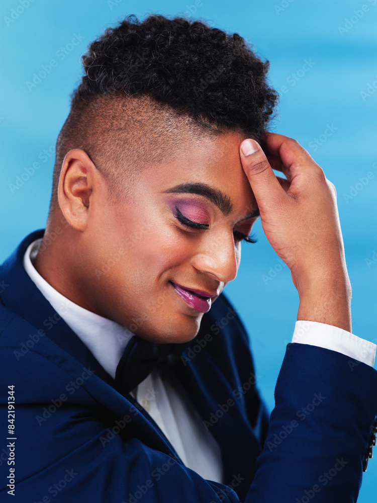 Sticker man, smile and makeup in studio with hand, fashion and cosmetics on blue background. gay male person