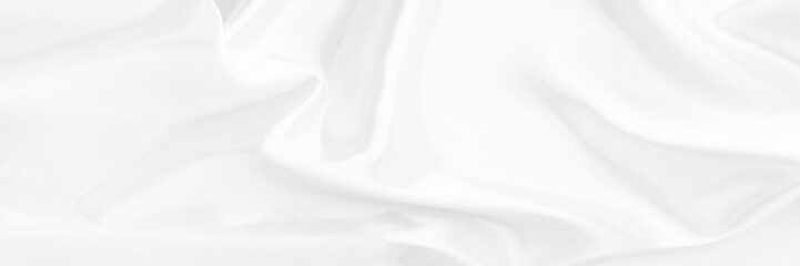White gray satin texture that is white silver fabric silk background with beautiful soft blur pattern natural.