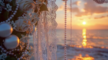 A vintage-inspired beach wedding setup with antique lace and pearls decorating the arch, the sunset providing a nostalgic amber backdrop.