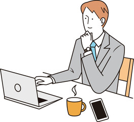 パソコン画面を眺める男性社員