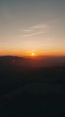 Mountain Silhouette Layers at Sunset