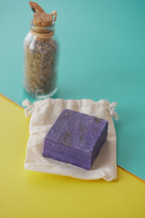 Homemade natural soap bar and lavender flower on table 