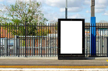 Mockup background texture of a large, blank white vertical rectangle billboard advertisement on a...