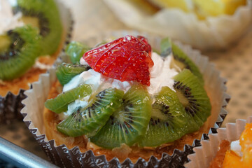 Strawberry and kiwi cupcake with whipped cream
