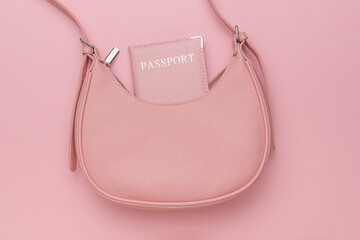 Pink Handbag with Passport on Pastel Pink Background - Travel Essentials and Fashion Accessories...