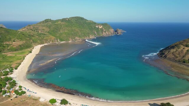 Kuta, Lombok: Aerial drone footage of the stunning Mawun beach near Kuta in southern Lombok in Indonesia. Shot wtih a forward motion. 
