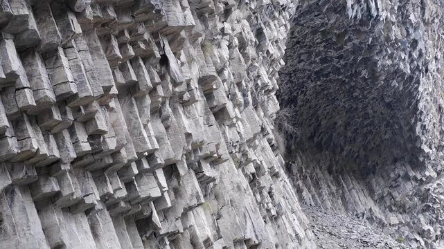 Tilt pan across shattered basalt pillars: Symphony of Stones, Armenia