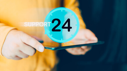 Man holding tablet with a symbol of on worldwide 24/7 service. Worldwide nonstop. Assistance customer services. Technician ready for service 24 hours. Available contact of customer service
