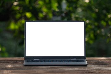 Mockup image of laptop with blank white screen on vintage wooden table in nature outdoor park - Powered by Adobe