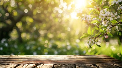 Spring background with a wooden table and a blurred green spring garden with a blossoming apple tree in the sunlight. Spring template for product display, 